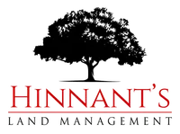 Logo for Hinnant's Land Management featuring a large black tree above the company name in bold red letters with a red line underneath.